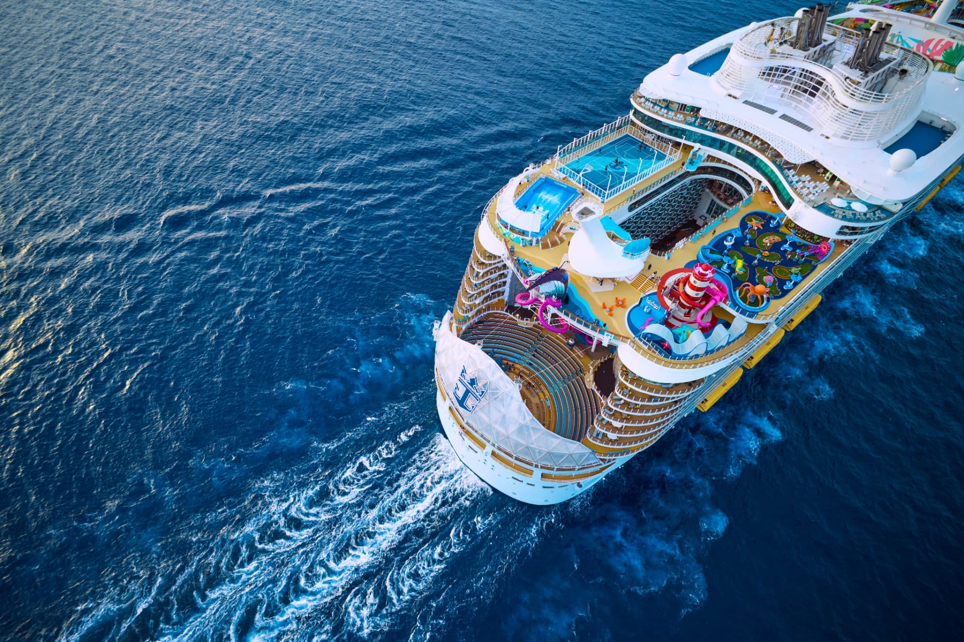 Aerial view of Royal Caribbean's Utopia of the Seas cruise ship sailing on bright blue water